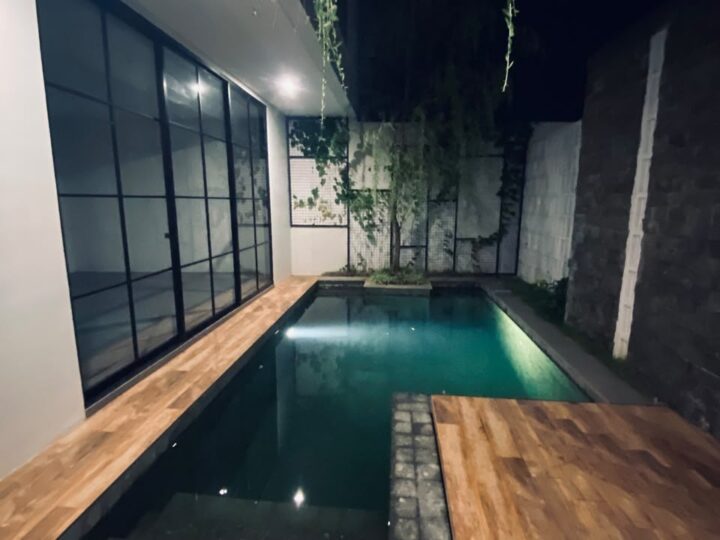 Pool timber deck at We Villa Cemagi
