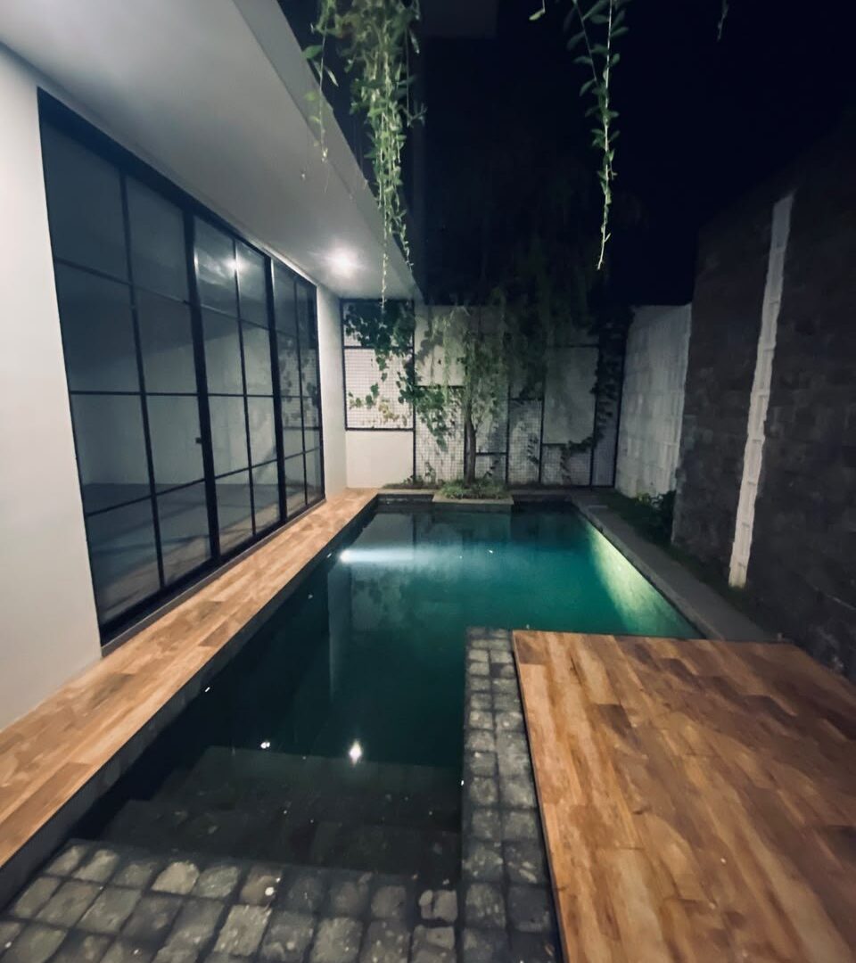 Pool timber deck at We Villa Cemagi